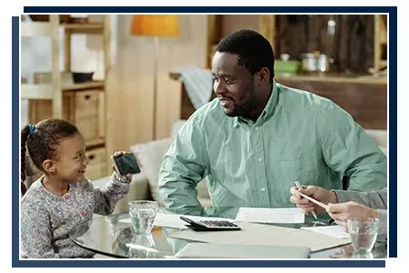 Daughter showing father an image on a cellphone