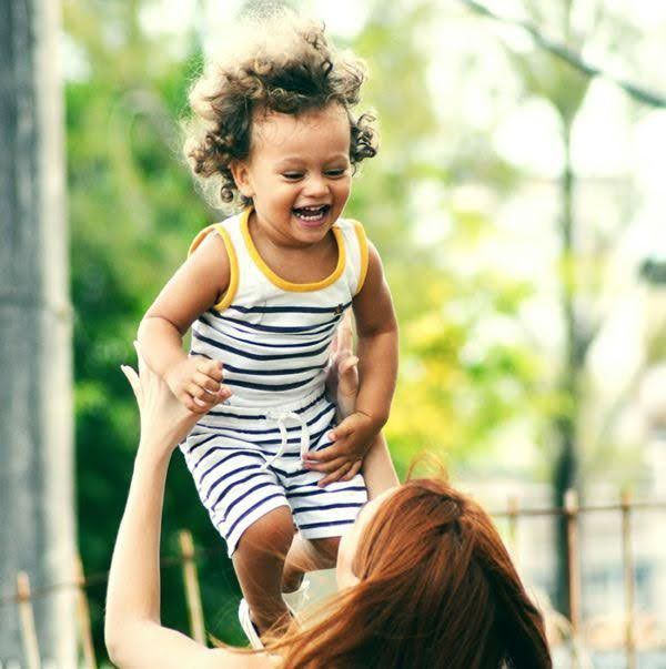 A mother is playing with her child