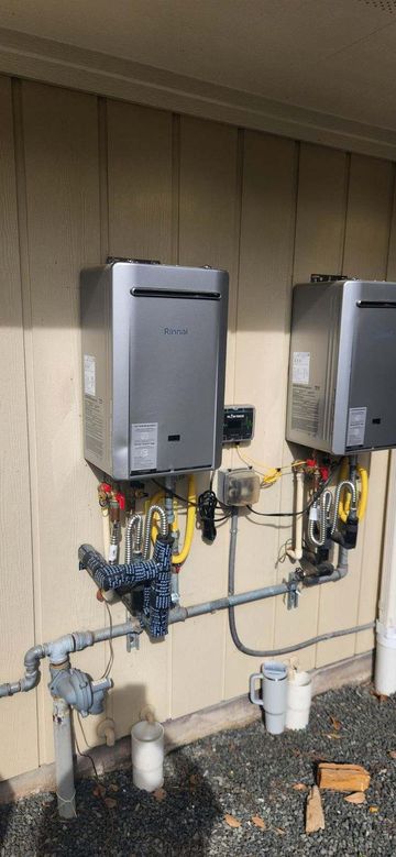 Water softener and tankless water heater in a garage.