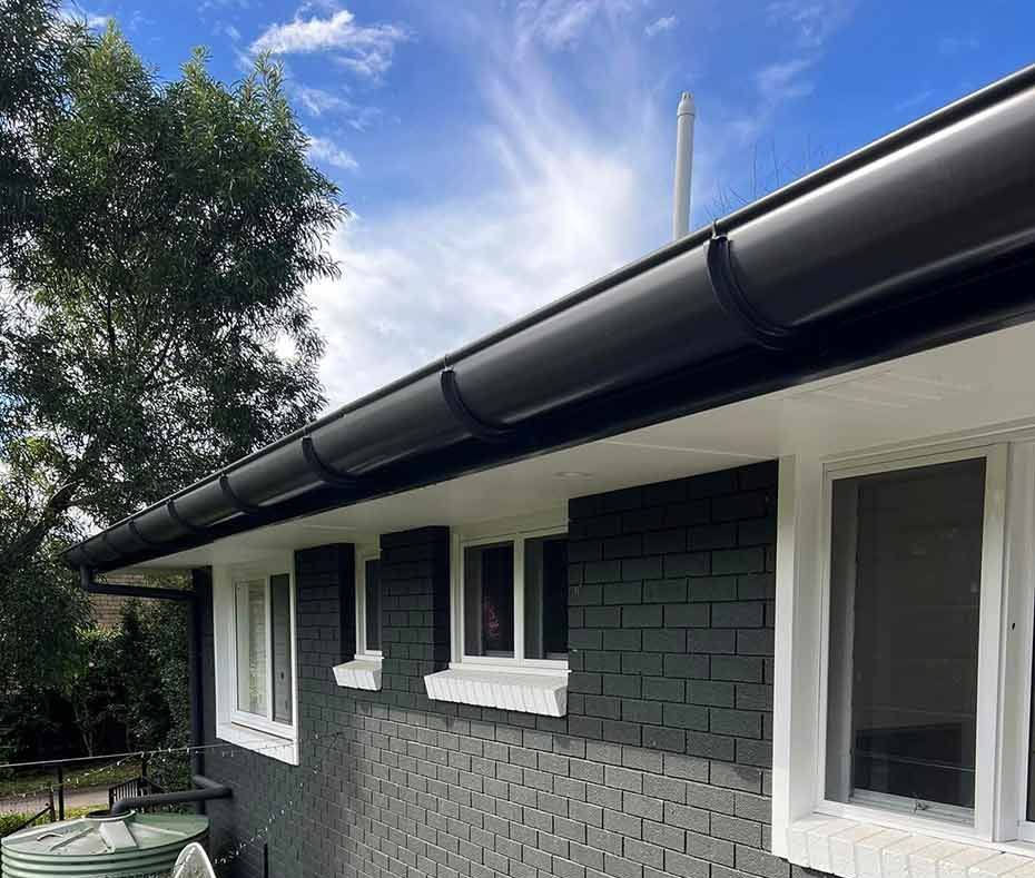 A House With a Black Gutter and White Windows — Gutterworx in Wamberal, NSW