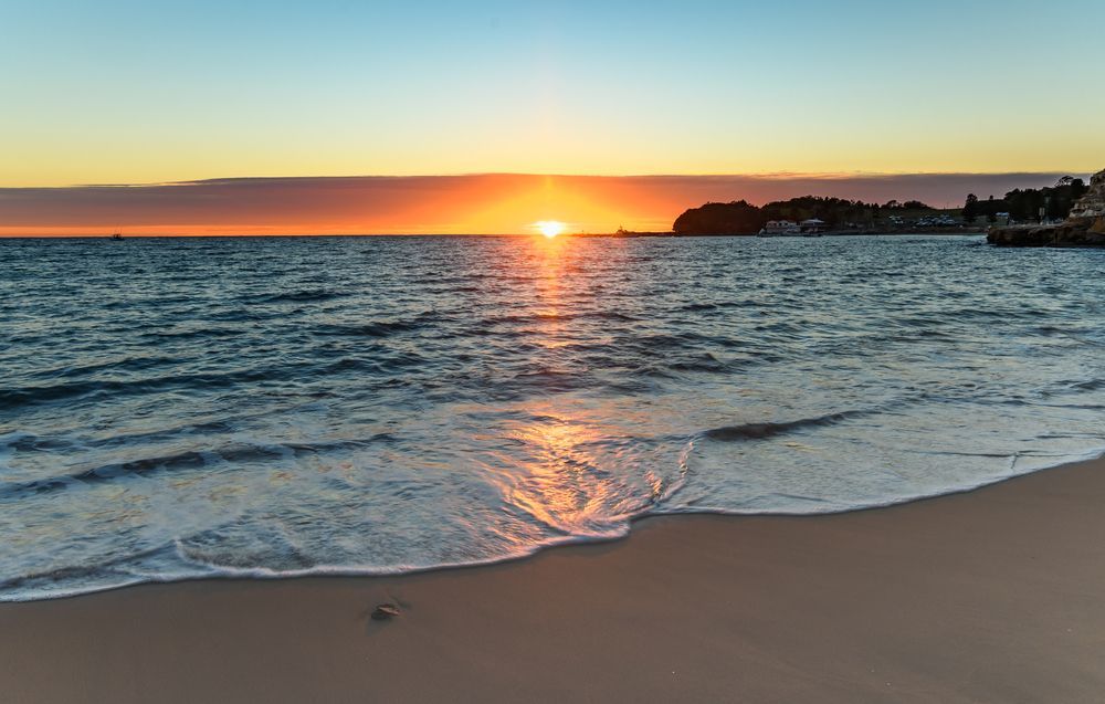Sunset Over a Calm Beach With Waves — Gutterworx in Berkeley Vale, NSW