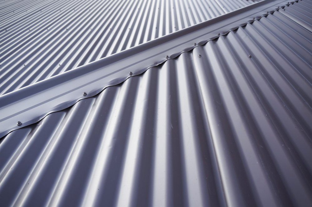 A close up of a new gray corrugated metal roof — Gutterworx In Wamberal NSW