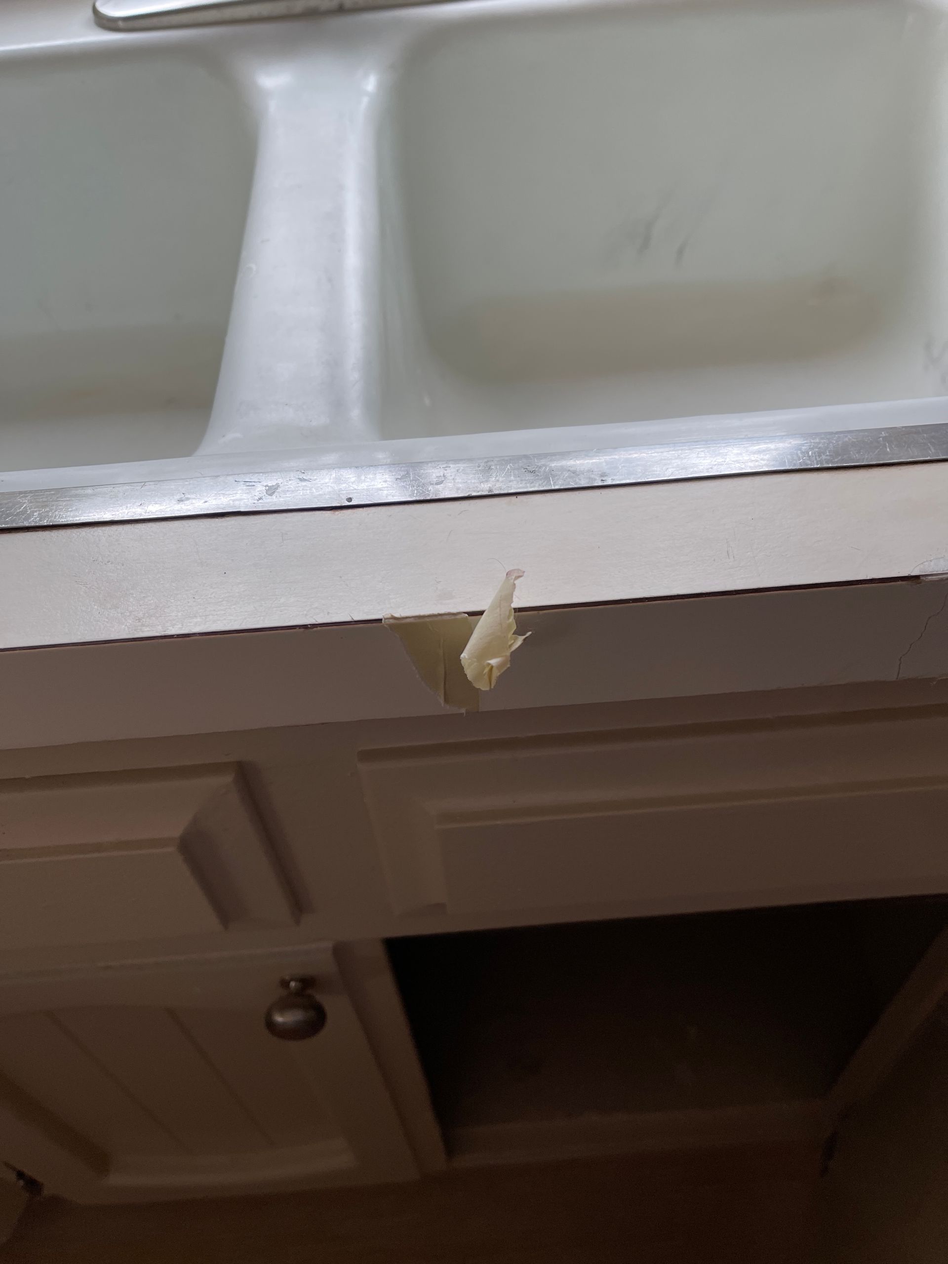 A kitchen sink with a hole in the counter top