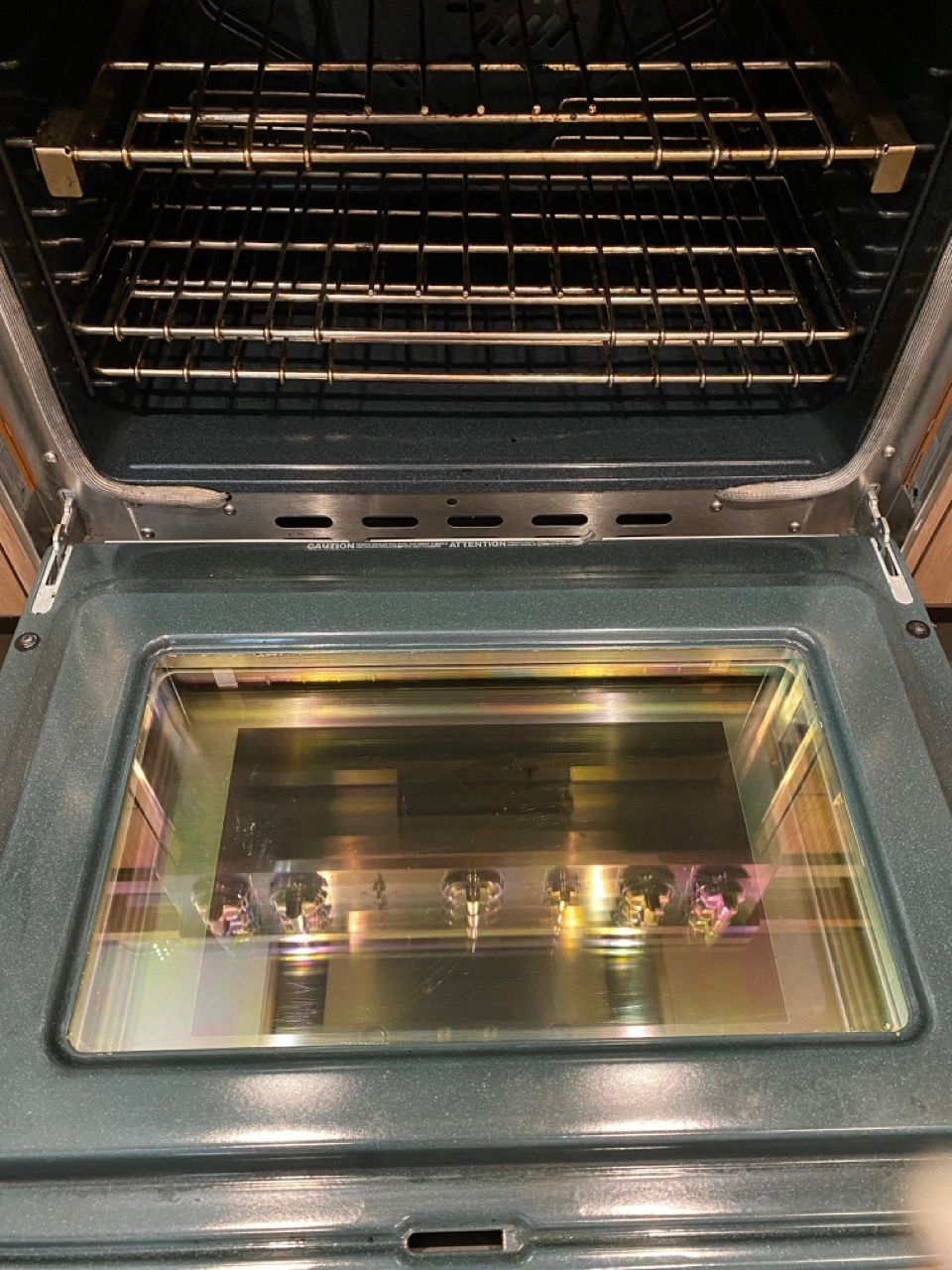 A close up of the inside of an oven with the door open.