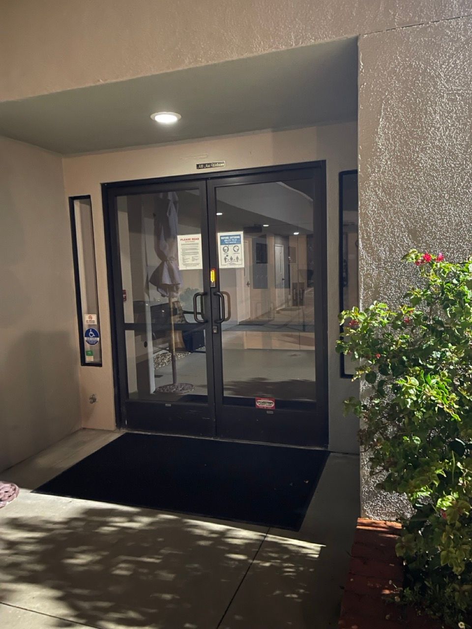 A building with a black mat in front of it