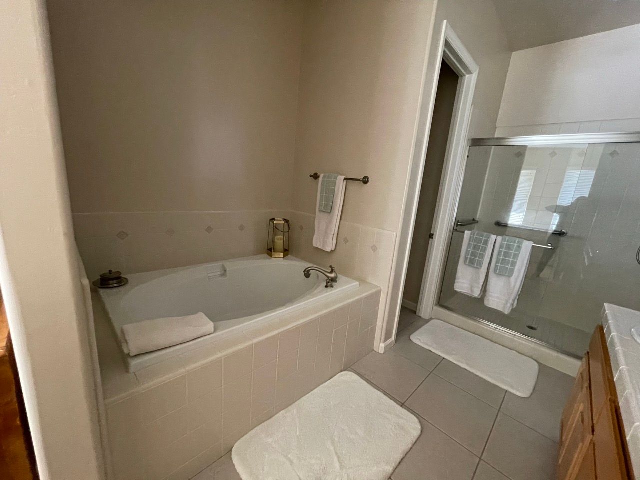 A bathroom with a bathtub and a shower.