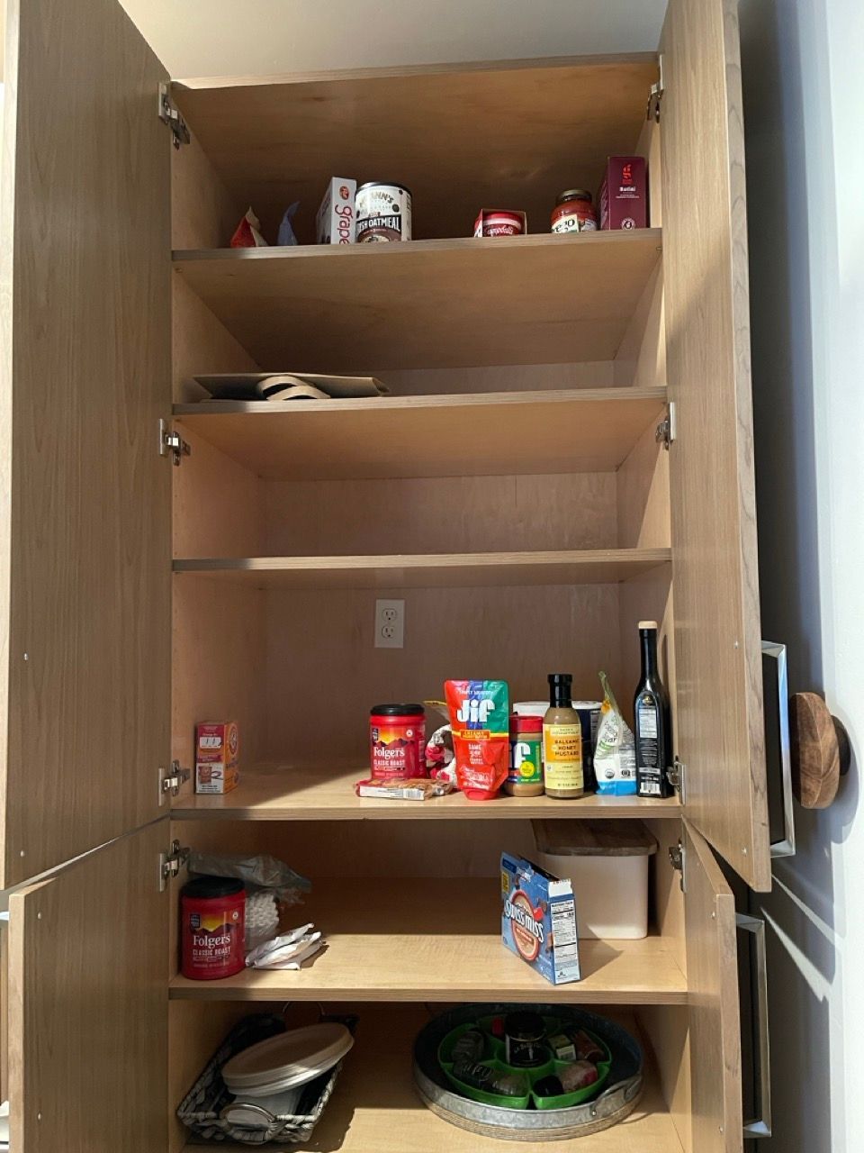The inside of a pantry with the door open