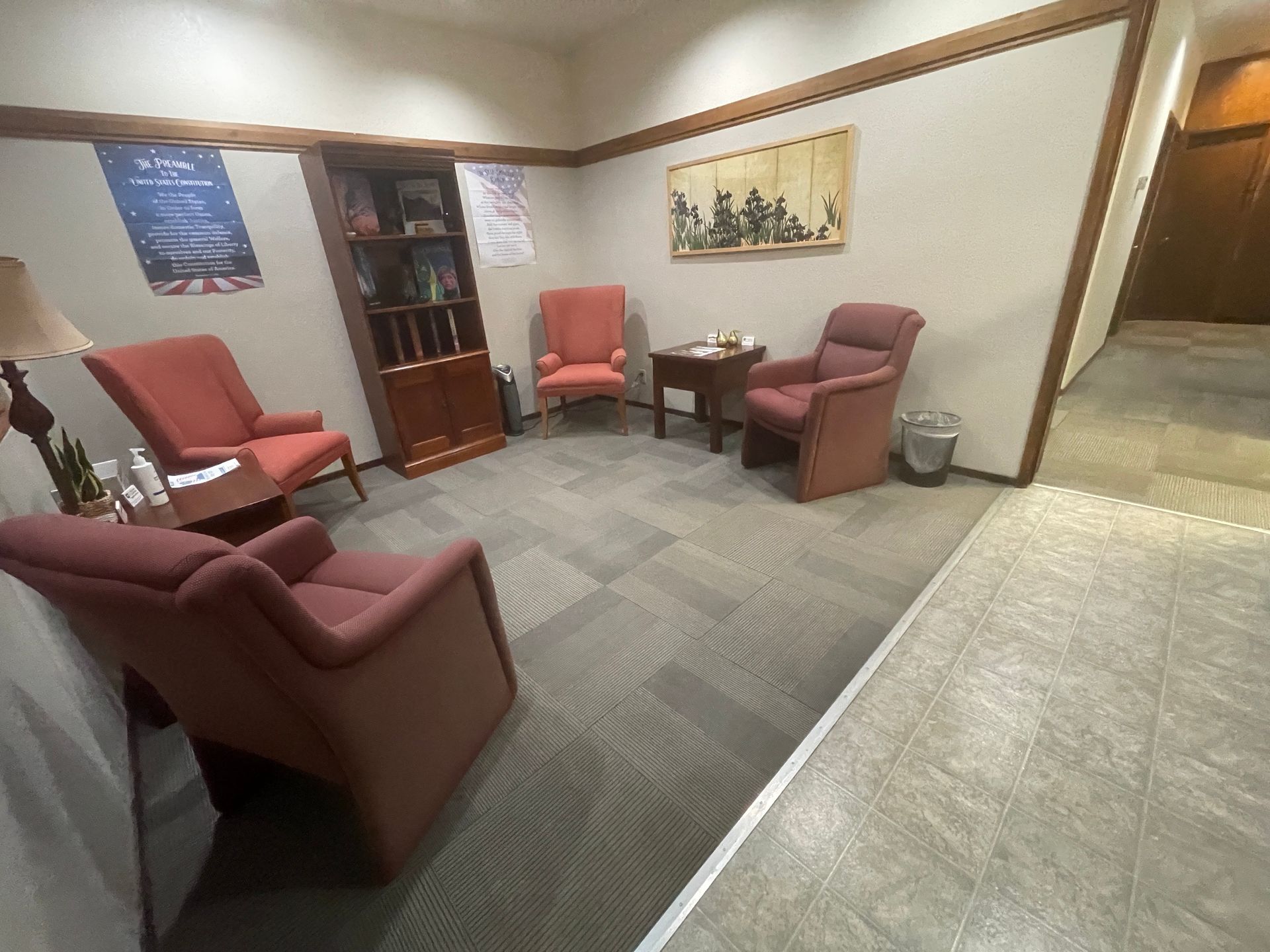 A waiting room with two chairs and a table