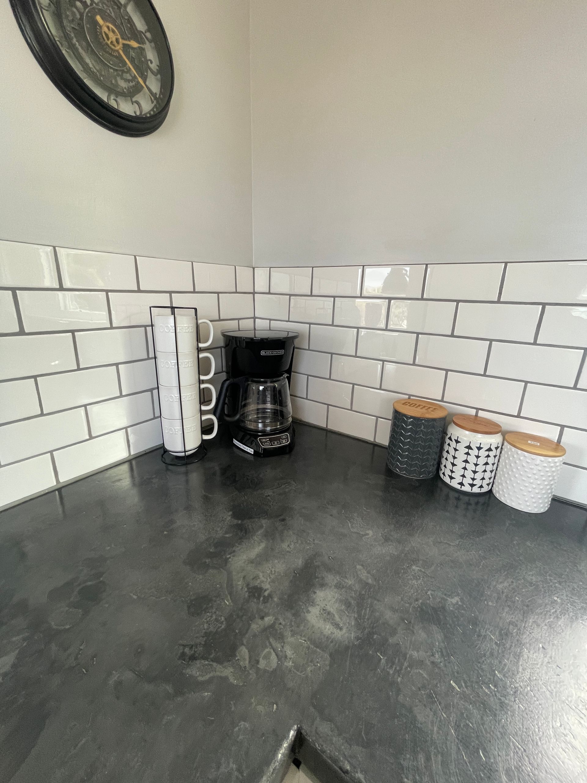 There is a coffee maker on the counter in the kitchen.