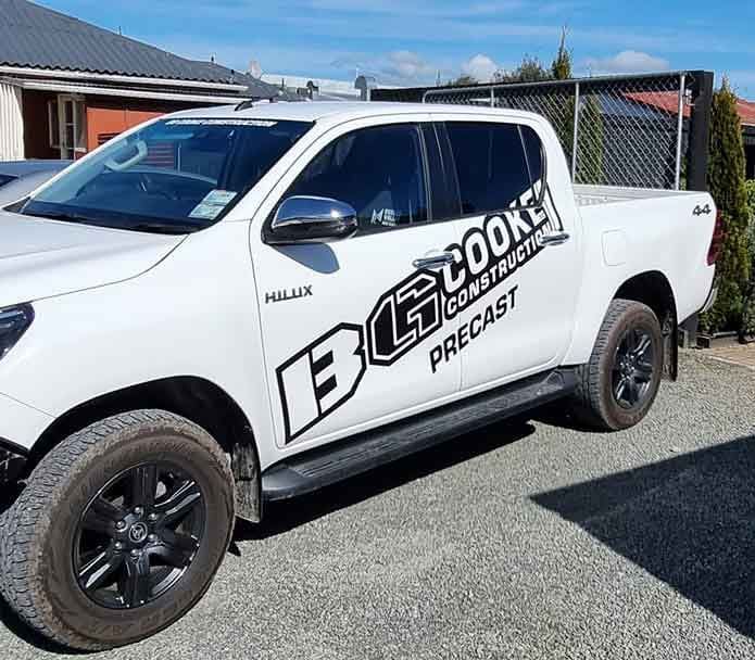 We created black vinyl ute signwriting with expert vehicle graphics, decals, wraps, and fleet branding for BG Cook.