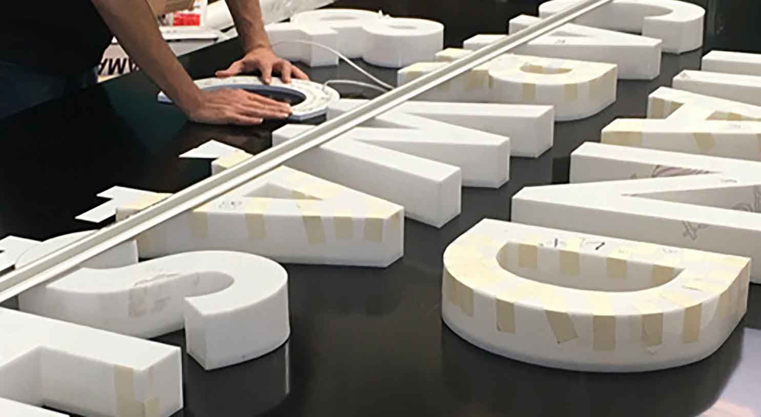 Bold plastic 3D lettering sign with shadow effect for shopfront