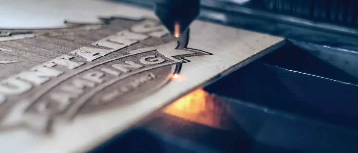 Laser cutting logo into wood Christchurch