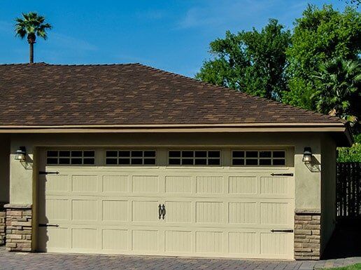 Almond Double Garage Door with Windows - Garage Doors in Glendale, AZ