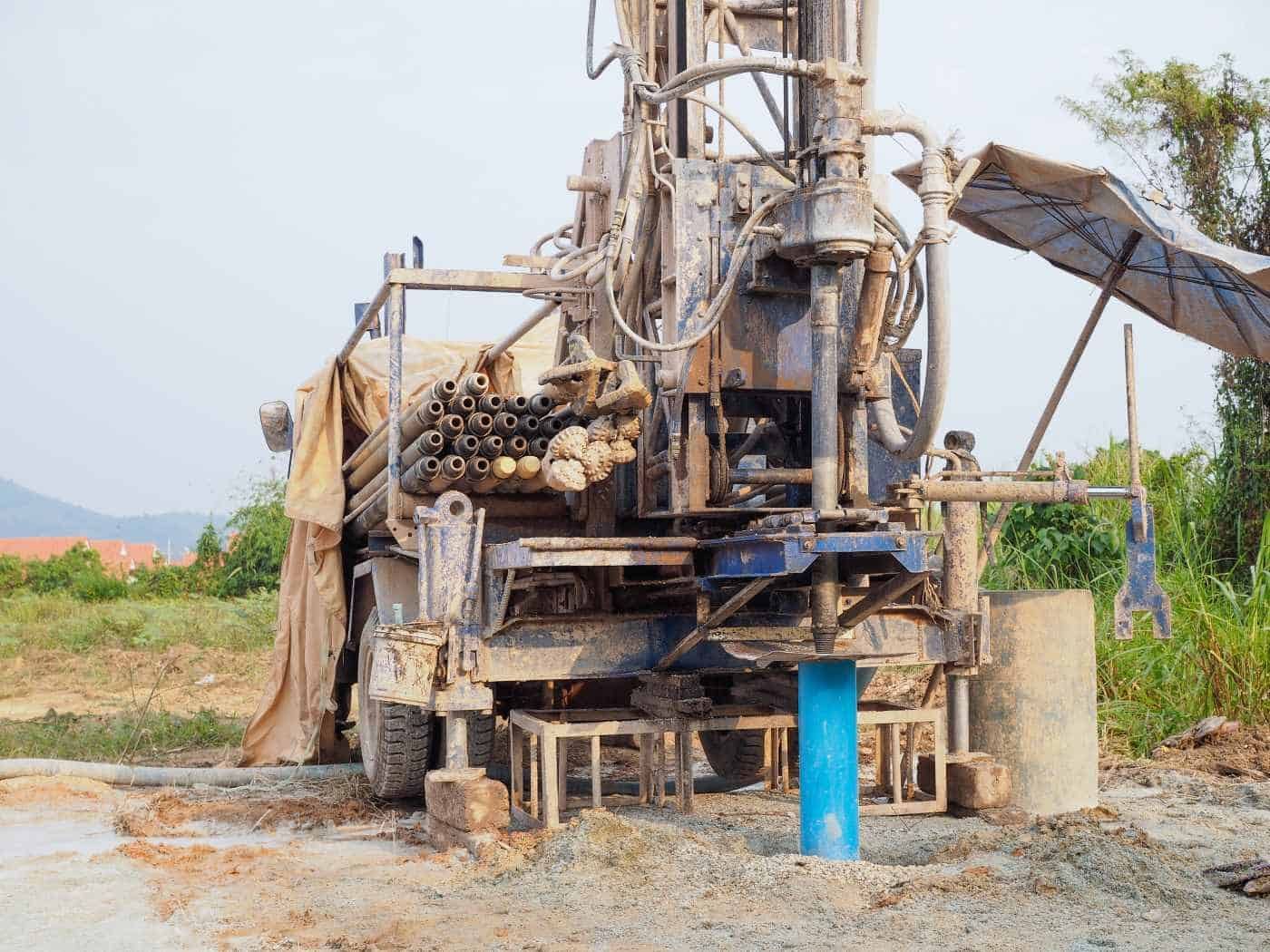 A Large Machine Is Drilling A Hole In The Ground In A Field — Water Resources Drilling In Coonabarabran, NSW