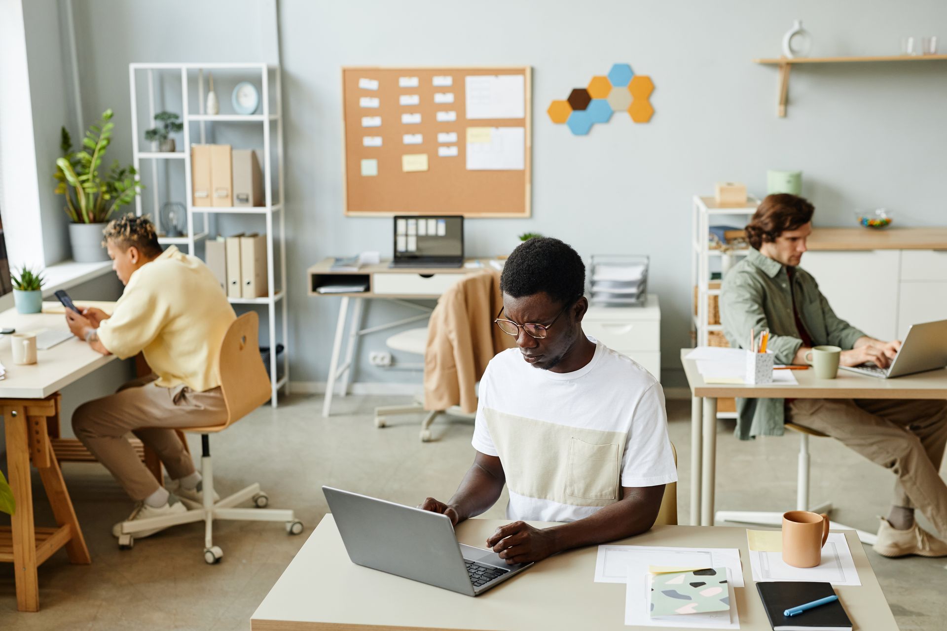 Couple in therapy session, listening to therapist taking notes.