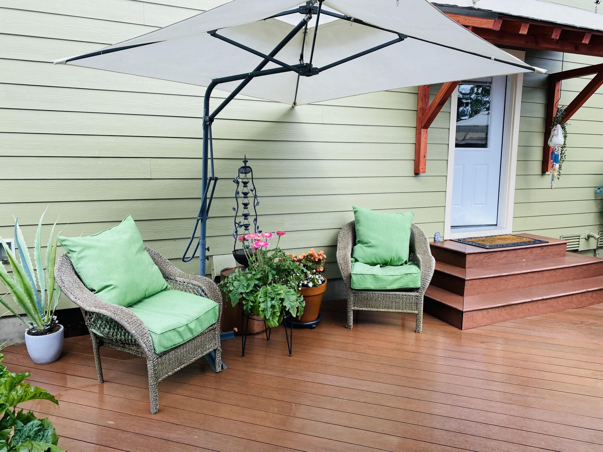 patio chairs on a new deck built by Chet's Roofing