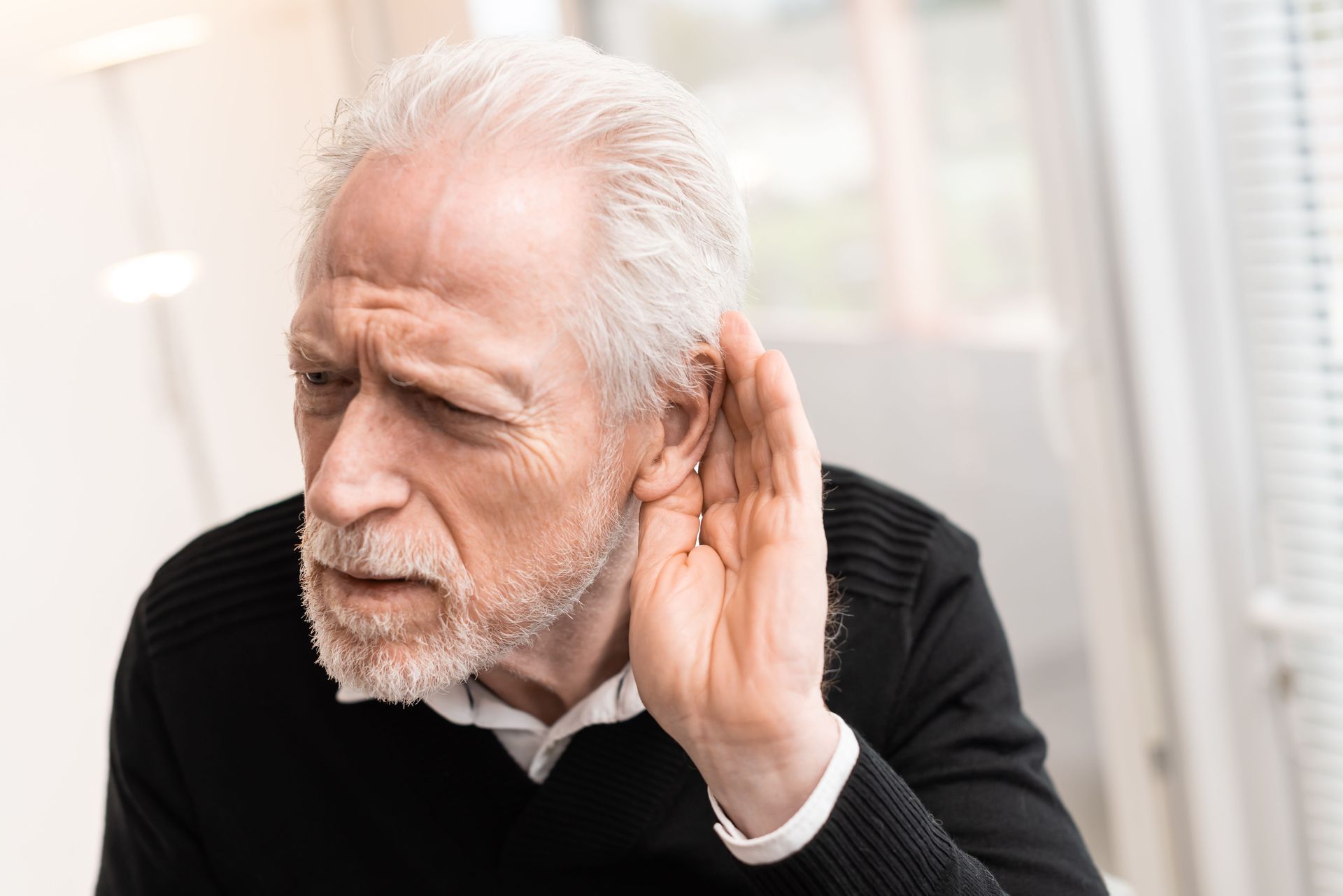old man listening for roof noises