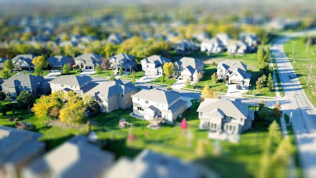 an aerial view of a residential neighborhood with houses and trees