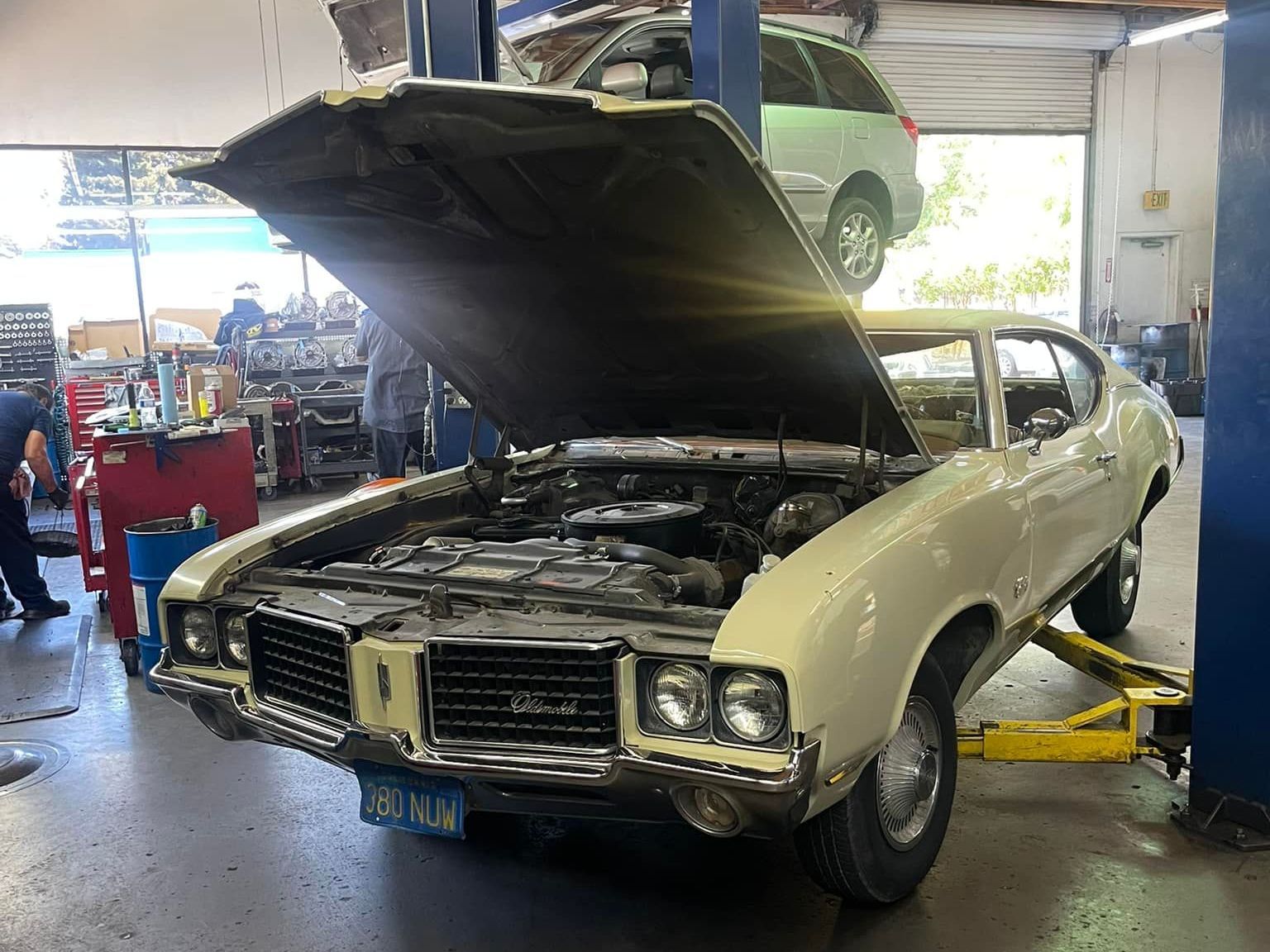A Group of Mechanics Are Working On A Car In A Garage | Rohnert Park Transmission & Auto Repair