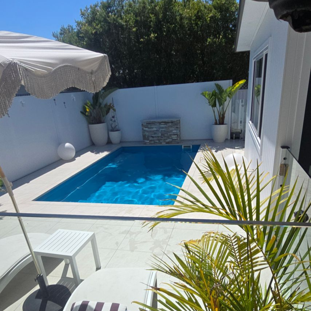 Clean Fiberglass Swimming Pool — Pool Installation in Macquarie Fields, NSW