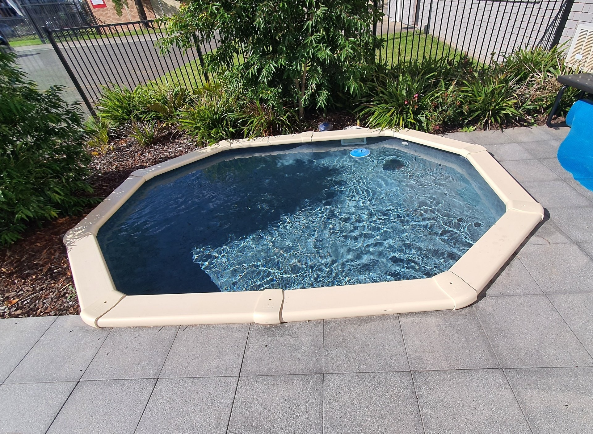 Walking Down Ladder into Pool — Pool Installation in Macquarie Fields, NSW
