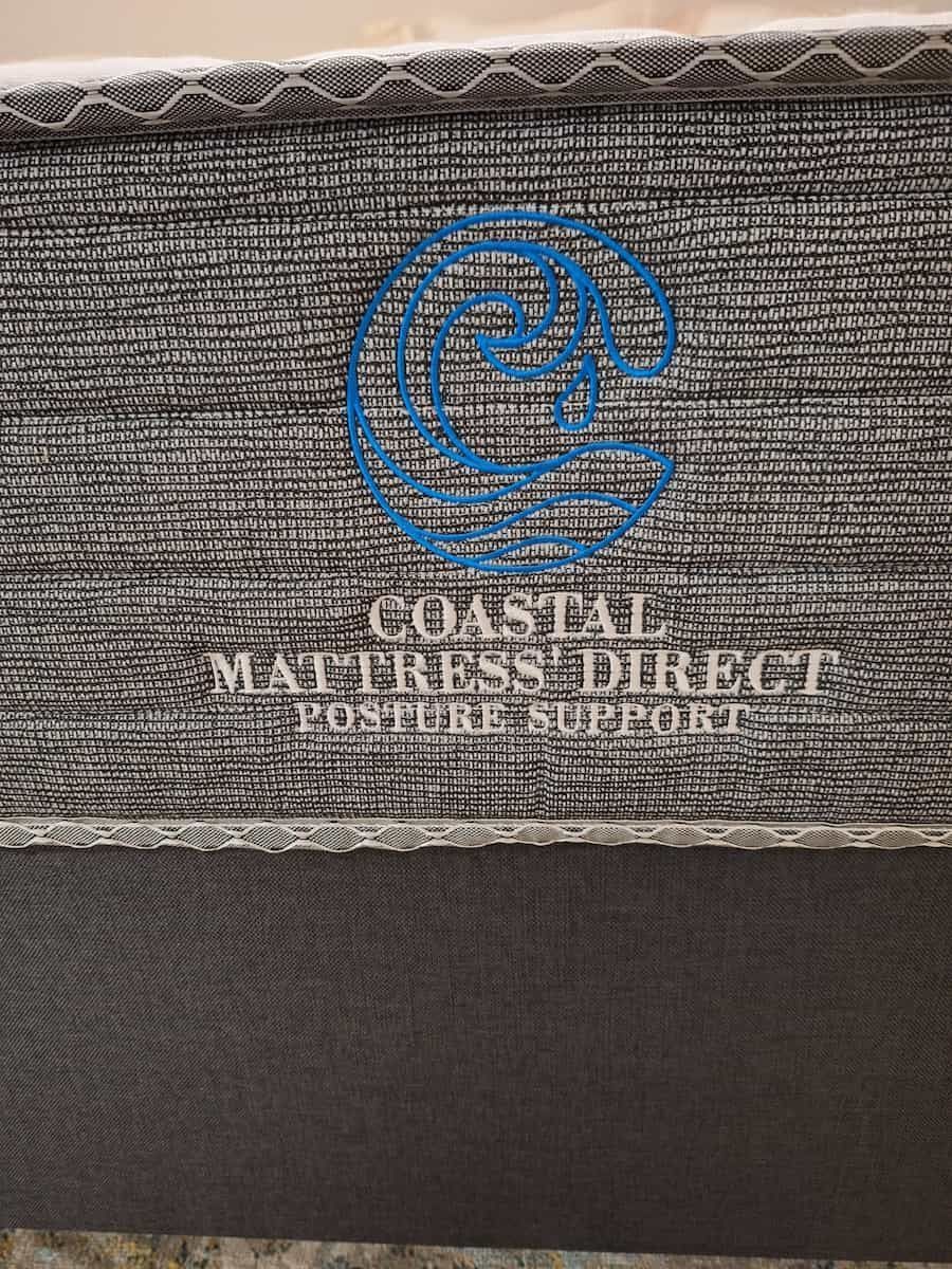 Coastal Mattress Direct mattress with a wave logo and