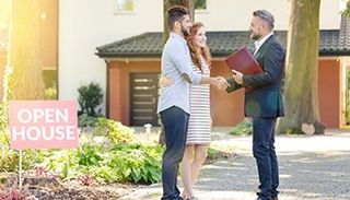 Couple Shaking hands with a lawyer — real estate attorney in Hendersonville, NC