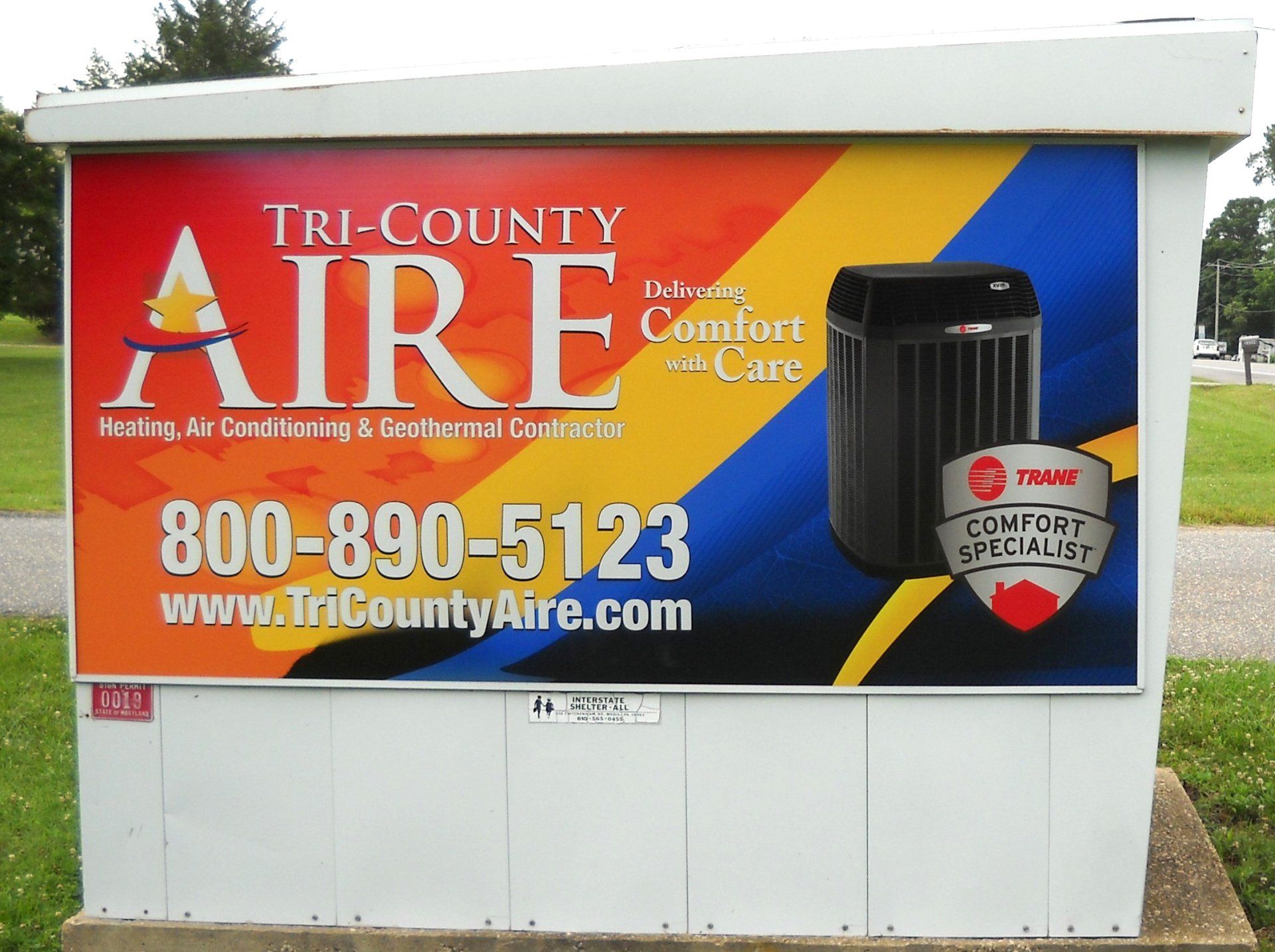 A tri-county aire sign with a picture of an air conditioner