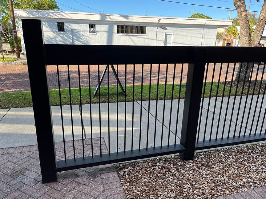 steel fence installed in brick and gravel