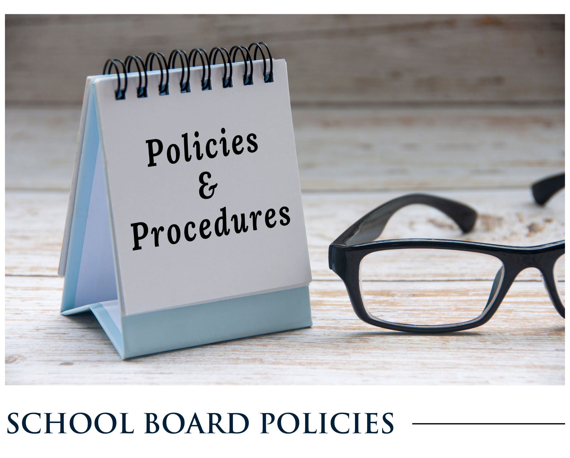 A notepad that says policies and procedures next to a pair of glasses