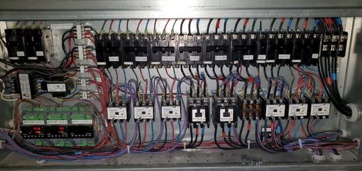 White rectangular air vent on a white textured ceiling.