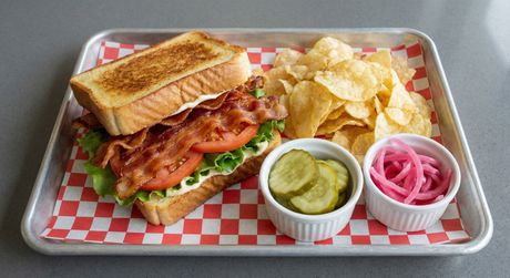 A chalkboard with the words image coming soon written on it