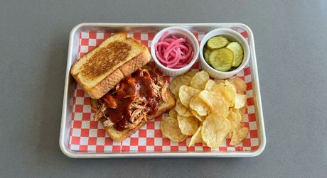 A chalkboard with the words image coming soon written on it