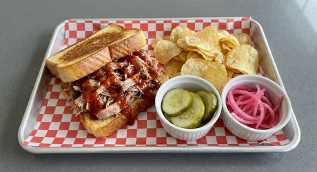 A chalkboard with the words image coming soon written on it