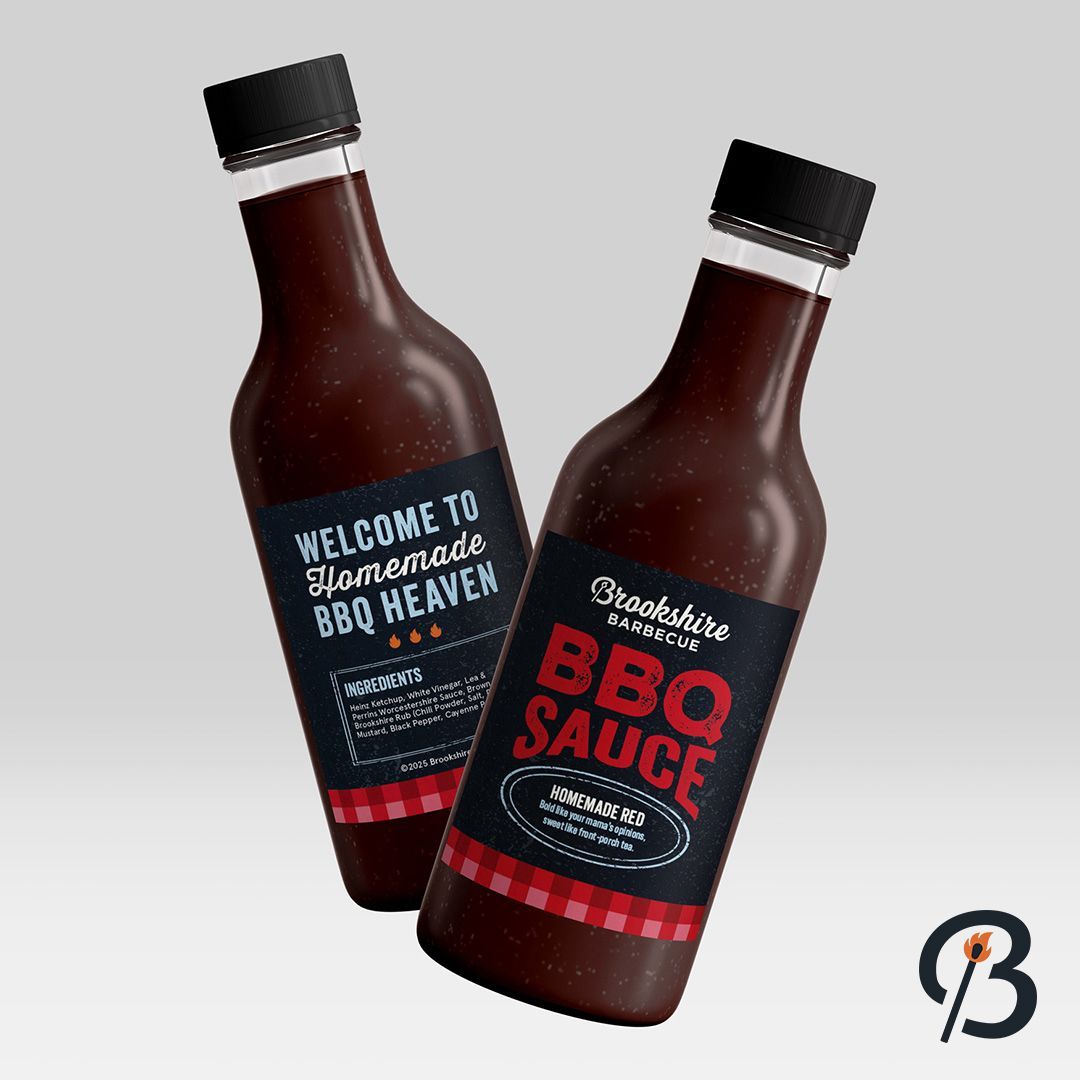 Two bottles of BBQ sauce with black labels on a grey background.