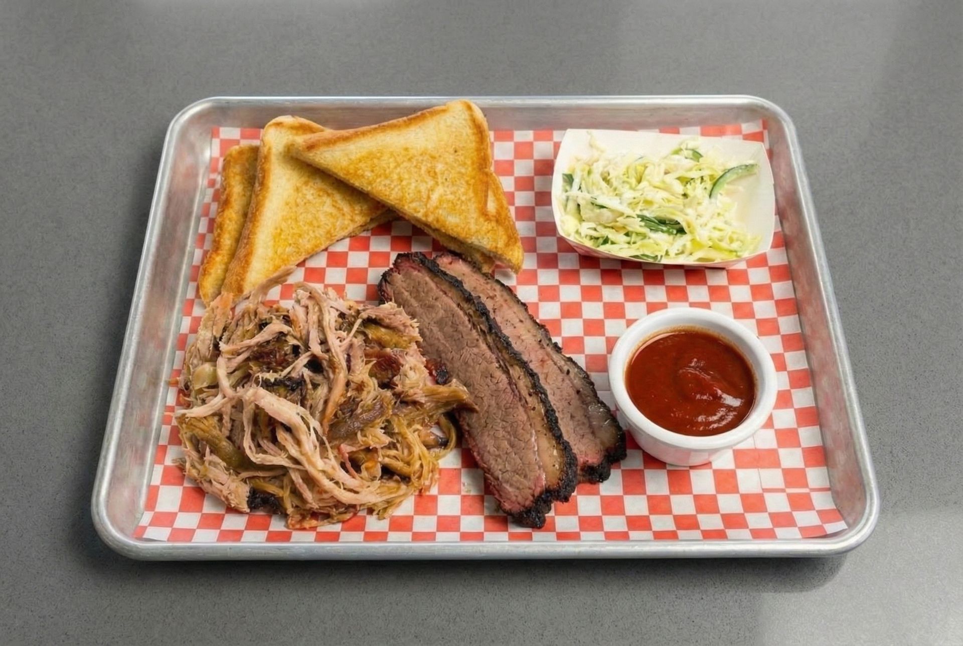 A rack of ribs is cooking on a grill in an oven.