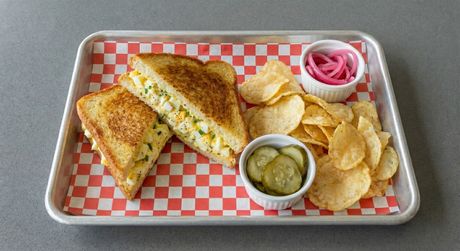 A chalkboard with the words image coming soon written on it