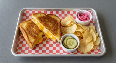 A chalkboard with the words image coming soon written on it