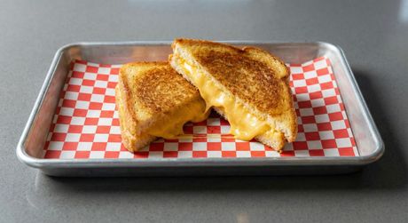 A chalkboard with the words image coming soon written on it