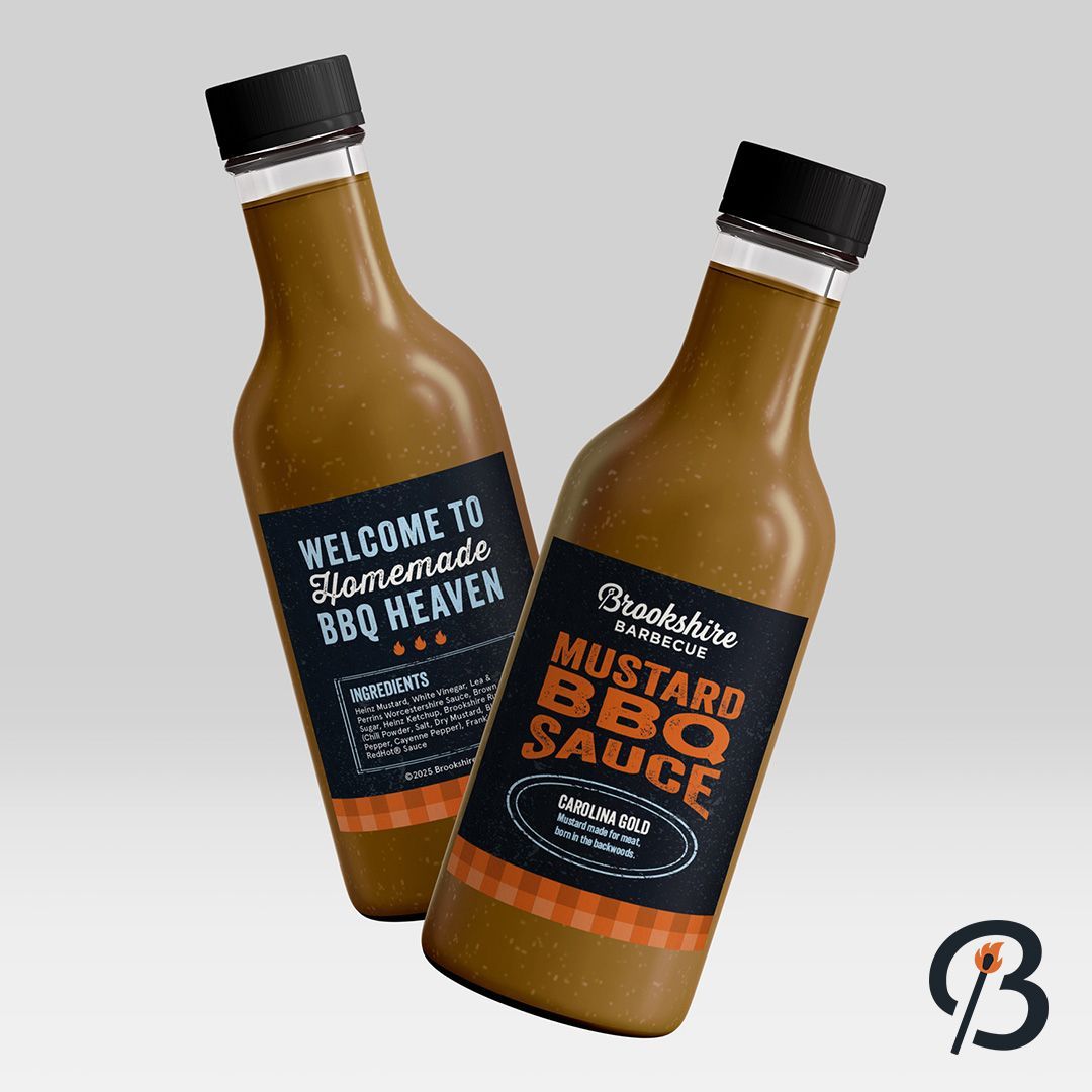 Two bottles of mustard BBQ sauce with black labels and caps.