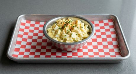 A chalkboard with the words image coming soon written on it