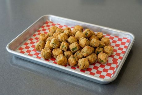 A chalkboard with the words image coming soon written on it