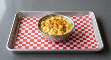 A chalkboard with the words image coming soon written on it