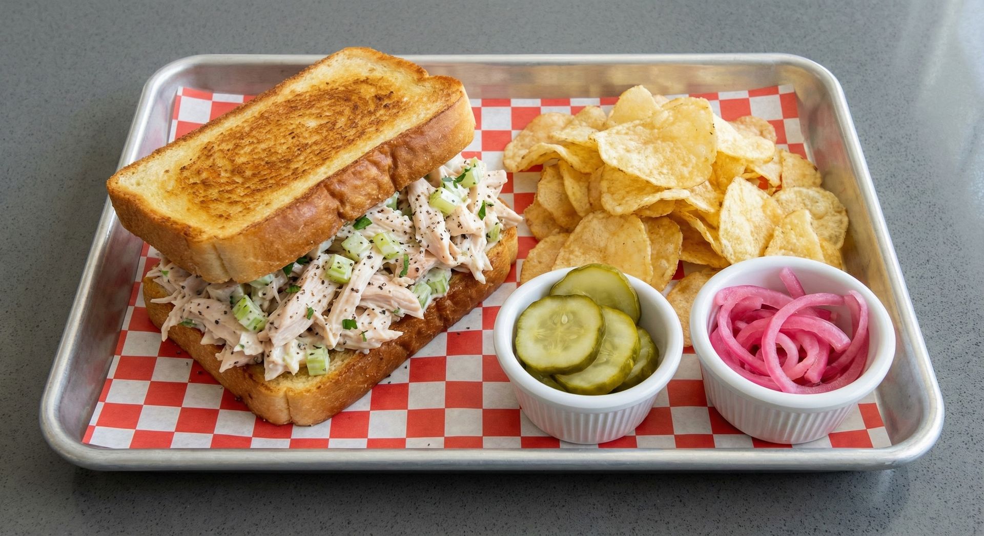 A chalkboard with the words image coming soon written on it