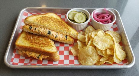 A chalkboard with the words image coming soon written on it