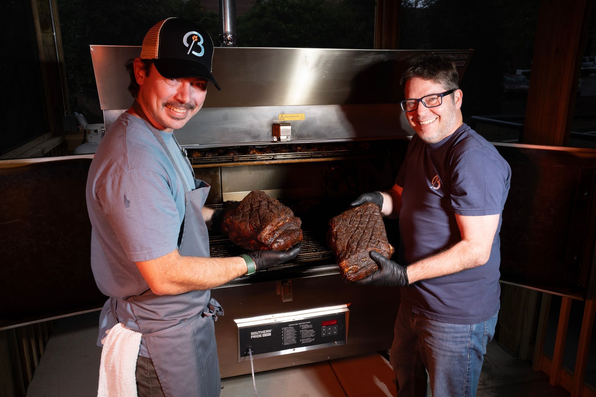 Chris and JC at Brookshire BBQ smoking meat