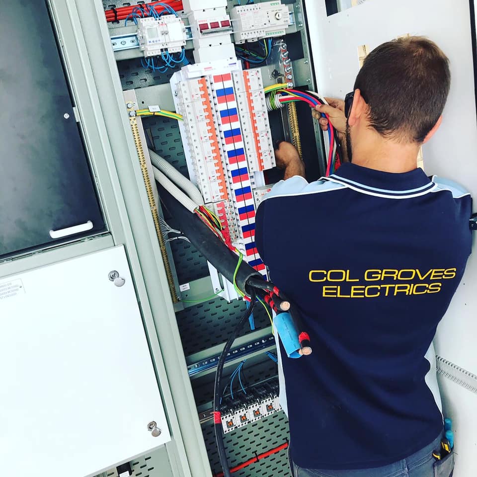 Electrician Working on Mains Power — Col Groves Electrics Pty Ltd in Ballina, NSW