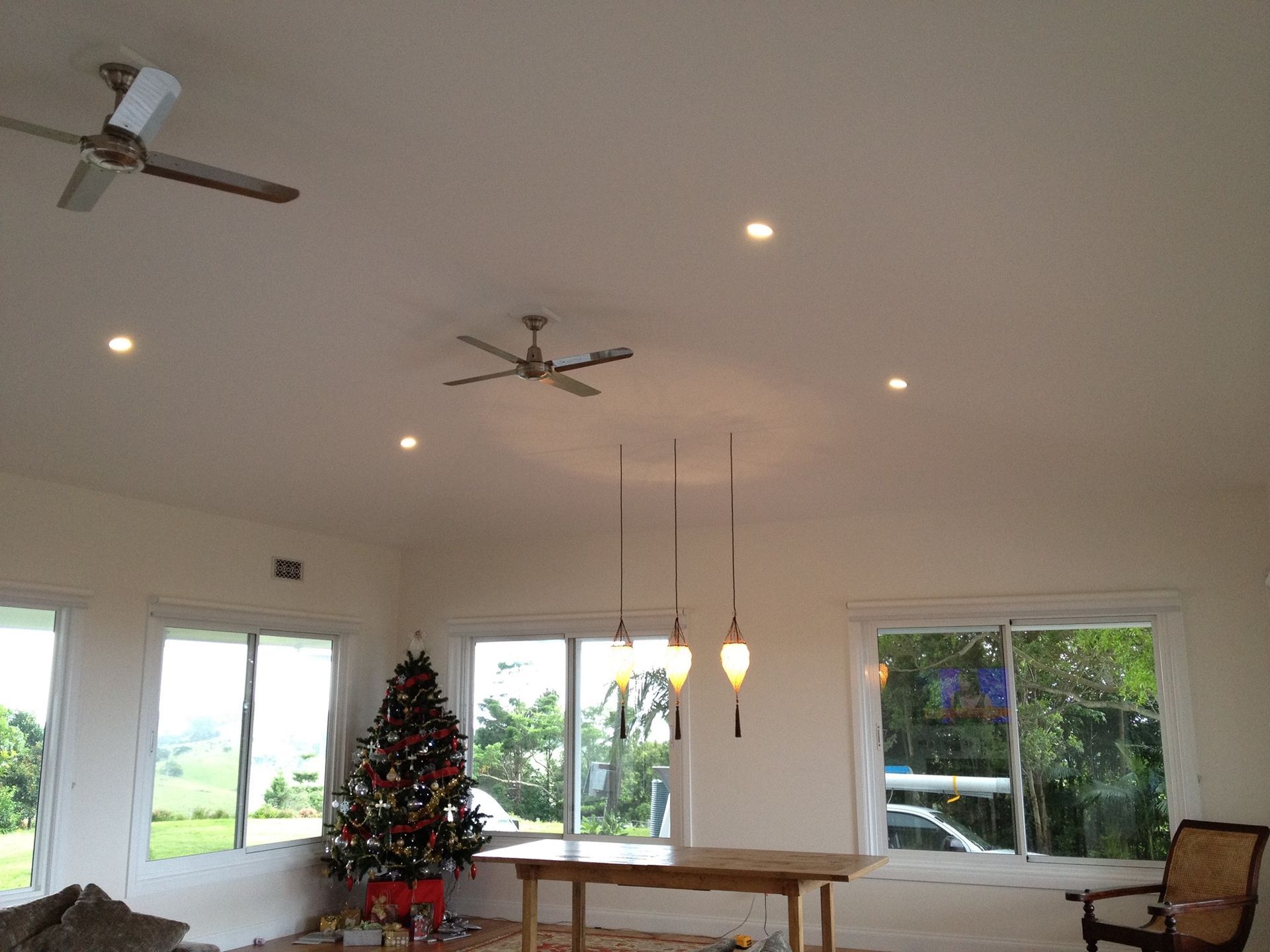 White-walled room with windows, ceiling fans and recessed lights — Col Groves Electrics Pty Ltd in Ballina, NSW