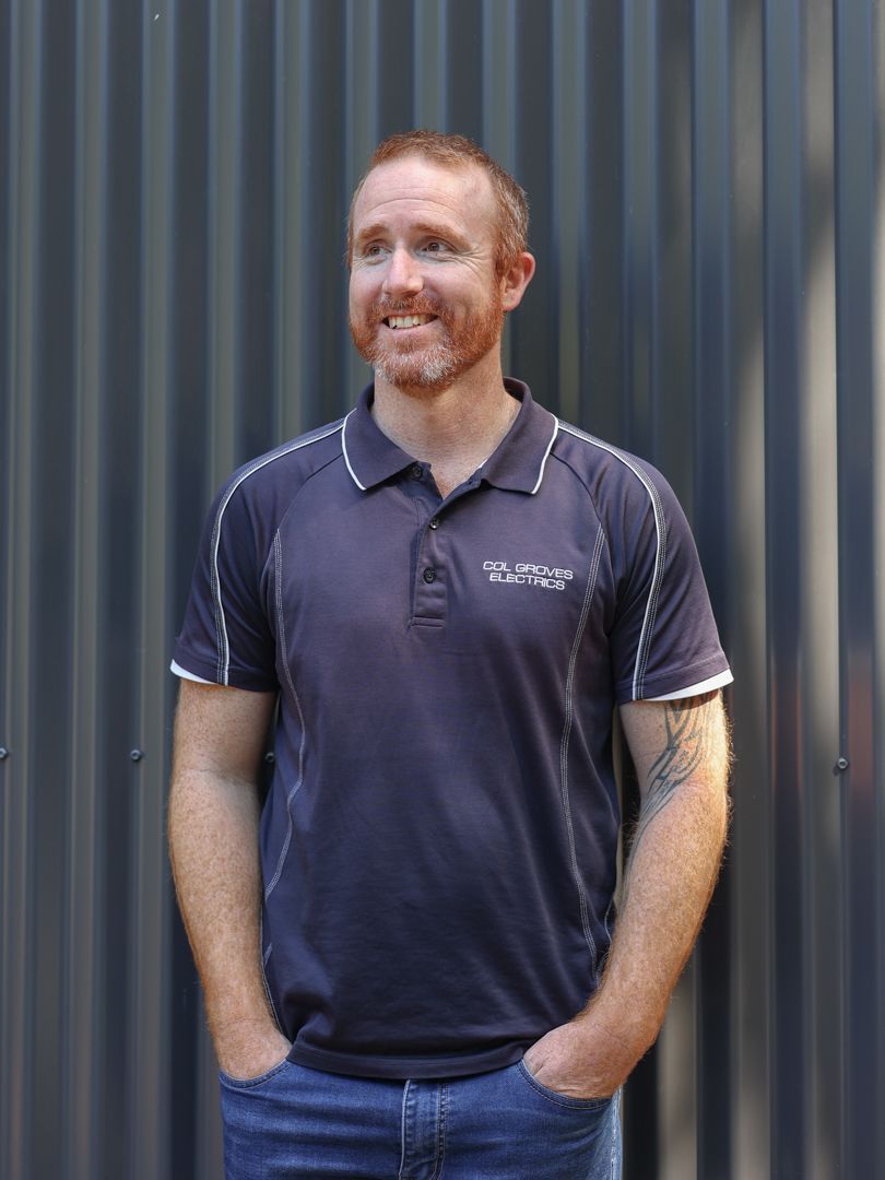 Man with red beard in navy polo shirt — Col Groves Electrics Pty Ltd in Ballina, NSW