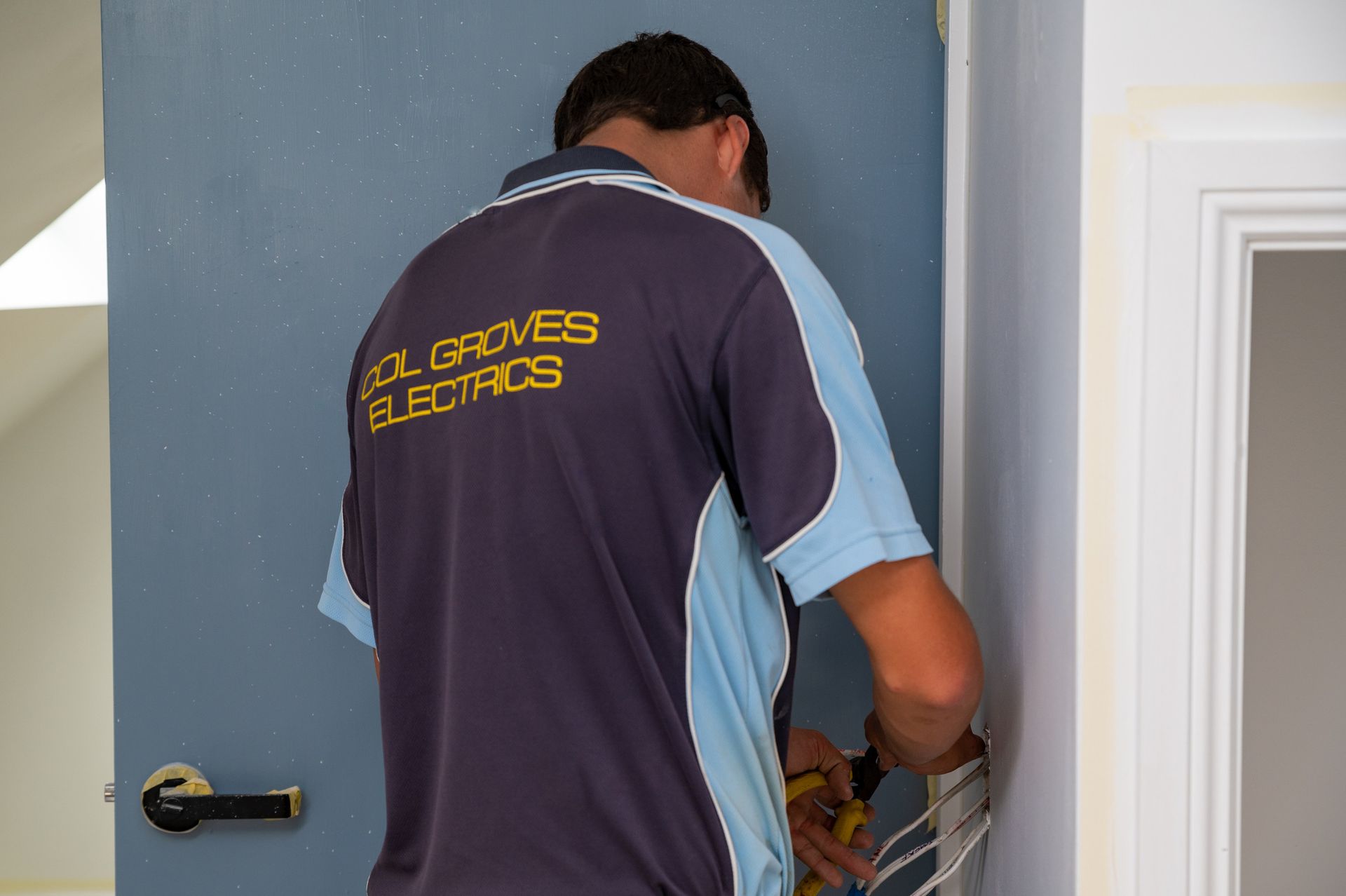 Electrician Working — Col Groves Electrics Pty Ltd in Ballina, NSW